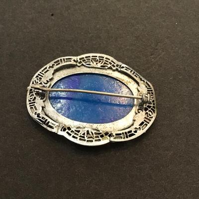 Sale Photo Thumbnail #143: Vintage Silvertone brooch with blue marble glass. Very nice please see attached photos.