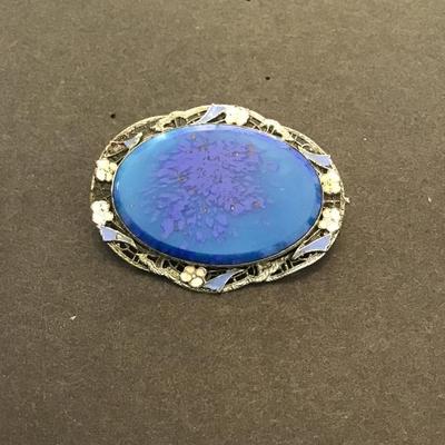 Sale Photo Thumbnail #142: Vintage Silvertone brooch with blue marble glass. Very nice please see attached photos.