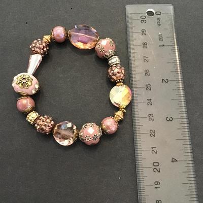 Sale Photo Thumbnail #149: Beautiful pink glass stretchy bracelet. Very nice. Please see attached photos.