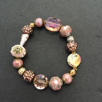Sale Photo Thumbnail #148: Beautiful pink glass stretchy bracelet. Very nice. Please see attached photos.