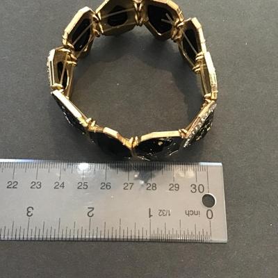 Sale Photo Thumbnail #163: Beautiful, golden and black fashion, statement, stretchy bracelet. Please see attached photos.