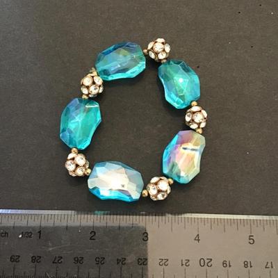 Sale Photo Thumbnail #211: Beautiful aqua blue glass, stretchy bracelet with rhinestones. Please see attached photos.