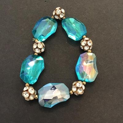 Sale Photo Thumbnail #210: Beautiful aqua blue glass, stretchy bracelet with rhinestones. Please see attached photos.