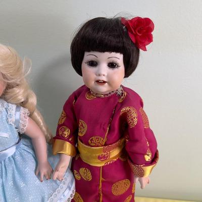 2 Porcelain Dolls Goldie Locks and Asian Doll