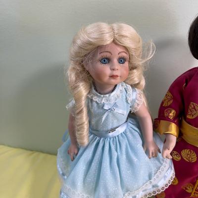 2 Porcelain Dolls Goldie Locks and Asian Doll