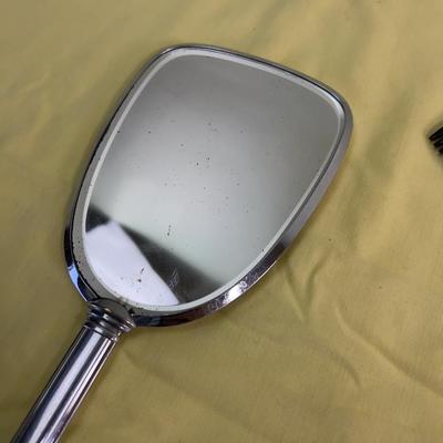 Mirror, Mirrors In the Hand, and a Comb