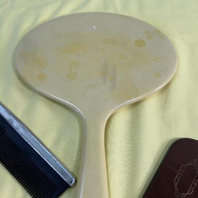Mirror, Mirrors In the Hand, and a Comb