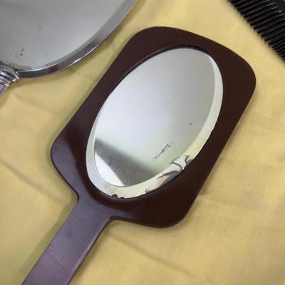 Mirror, Mirrors In the Hand, and a Comb