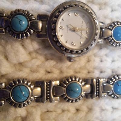 Sale Photo Thumbnail #36: There are no markings to indicate that is silver or real turquoise, it is costume but is very pretty costume.  There is an extra link to use on the watch or bracelet.