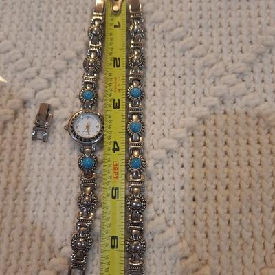 Sale Photo Thumbnail #34: There are no markings to indicate that is silver or real turquoise, it is costume but is very pretty costume.  There is an extra link to use on the watch or bracelet.