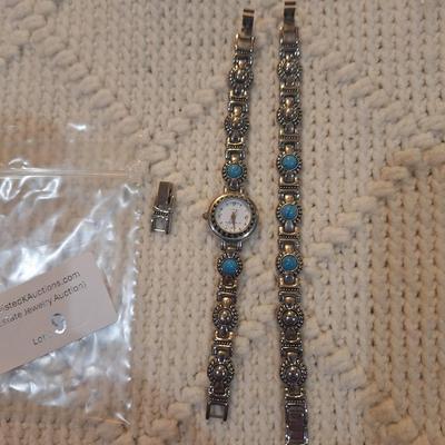 Sale Photo Thumbnail #38: There are no markings to indicate that is silver or real turquoise, it is costume but is very pretty costume.  There is an extra link to use on the watch or bracelet.