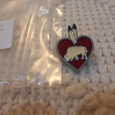 Sale Photo Thumbnail #70: Vintage enamel lapel pin featuring a heart with a bison and feathers