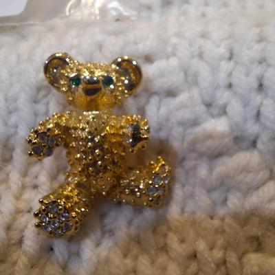 Sale Photo Thumbnail #75: small vintage teddy bear brooch with green eyes