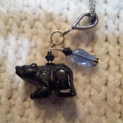 Sale Photo Thumbnail #94: Sterling silver chain with bear and bead pendant.