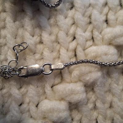 Sale Photo Thumbnail #96: Sterling silver chain with bear and bead pendant.