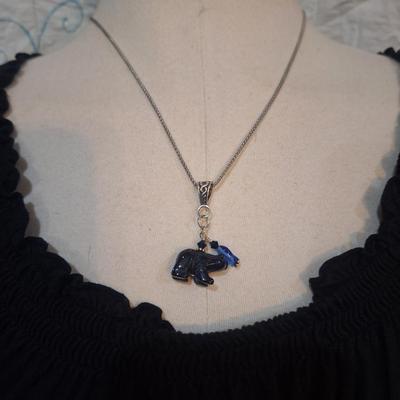 Sale Photo Thumbnail #99: Sterling silver chain with bear and bead pendant.