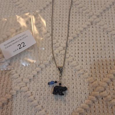 Sale Photo Thumbnail #92: Sterling silver chain with bear and bead pendant.