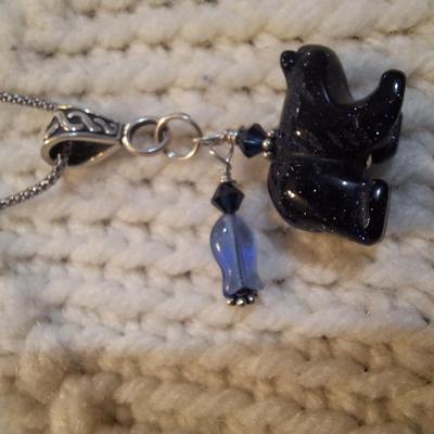 Sale Photo Thumbnail #93: Sterling silver chain with bear and bead pendant.