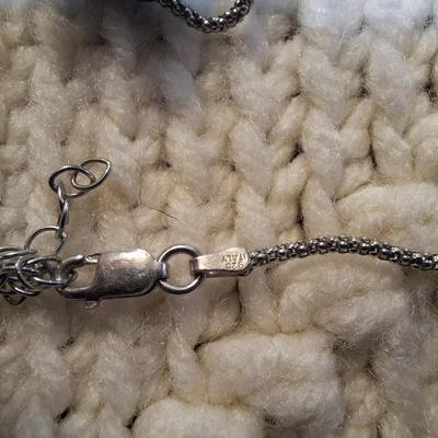 Sale Photo Thumbnail #97: Sterling silver chain with bear and bead pendant.