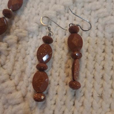 Sale Photo Thumbnail #101: Brown beaded necklace with pendant and matching earrings