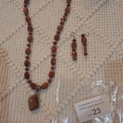 Sale Photo Thumbnail #100: Brown beaded necklace with pendant and matching earrings