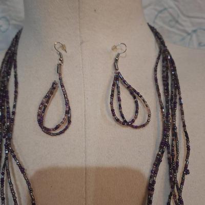 Sale Photo Thumbnail #107: Long purple seed bead necklace with matching earrings.