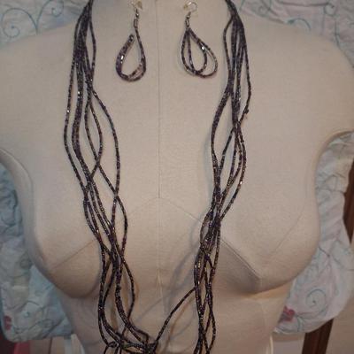 Sale Photo Thumbnail #106: Long purple seed bead necklace with matching earrings.