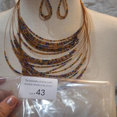 Sale Photo Thumbnail #187: multi strand necklace with orange and blue seed beads and matching earrings