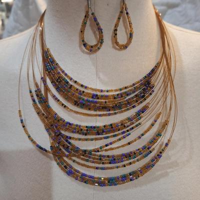 Sale Photo Thumbnail #188: multi strand necklace with orange and blue seed beads and matching earrings
