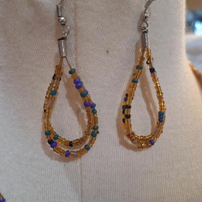 Sale Photo Thumbnail #190: multi strand necklace with orange and blue seed beads and matching earrings