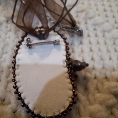 Sale Photo Thumbnail #194: handcrafted necklace and earring set with large pendant.  Pendant and earrings have leather backing.  Pendant can also be a brooch.