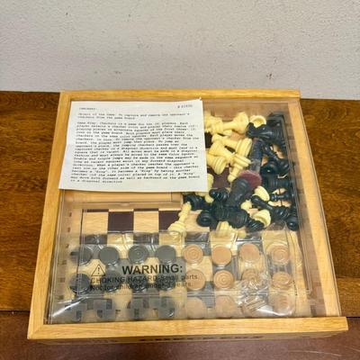 Sale Photo Thumbnail #318: Sliding clear plastic cover.  Includes pieces for checkers and chess (missing the black queen).  Also included is a small hinged lid Tic-Tac-Toe box with 10 pieces.