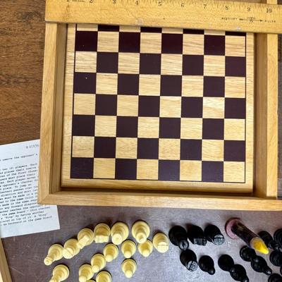 Sale Photo Thumbnail #320: Sliding clear plastic cover.  Includes pieces for checkers and chess (missing the black queen).  Also included is a small hinged lid Tic-Tac-Toe box with 10 pieces.