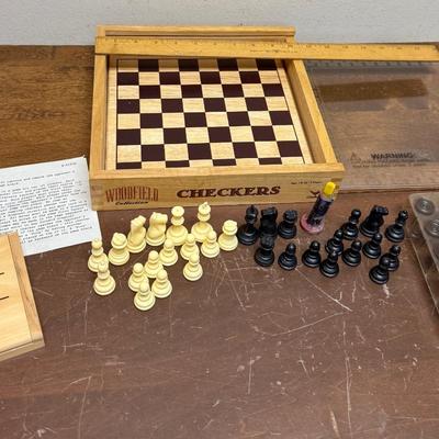 Sale Photo Thumbnail #321: Sliding clear plastic cover.  Includes pieces for checkers and chess (missing the black queen).  Also included is a small hinged lid Tic-Tac-Toe box with 10 pieces.