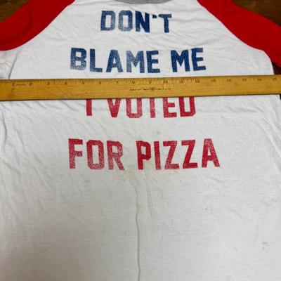 Sale Photo Thumbnail #330: Junior size L (11/13).  Used but in good condition.  Patriotic red-white-blue colors, printing on the from reads " Don't Blame Me I Voted For Pizza".