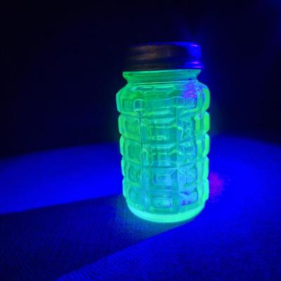 Vaseline glass or uranium glass salt shaker