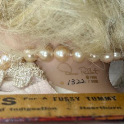 Sale Photo Thumbnail #243: In fair condition. Her hair is a little messy. Her hands have had velcro applied to hands to keep them together in prayer. She's wearing a vintage pearl necklace.