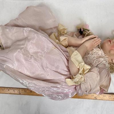 Sale Photo Thumbnail #244: In fair condition. Her hair is a little messy. Her hands have had velcro applied to hands to keep them together in prayer. She's wearing a vintage pearl necklace.