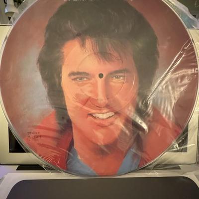 Sale Photo Thumbnail #66: The image you sent shows a vintage vinyl record album titled "To Elvis: Love Still Burning". 
Here's some information about this record:
Format and Content: It's a 12-inch picture disc LP featuring an image of Elvis Presley. The album is a tribute compila