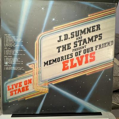 Sale Photo Thumbnail #110: "J.D. Sumner and The Stamps Present Memories of Our Friend Elvis Live On Stage". 
Here's some information about this vinyl record:
Artists: J.D. Sumner & The Stamps, and The TCB Band.
Album Title: Memories Of Our Friend Elvis.
Format: It is a 2xLP (double