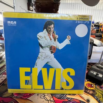 Sale Photo Thumbnail #143: Elvis Presley double LP vinyl album, released by RCA Records in 1973. 
Here's more information about this album:
Title: Simply titled "ELVIS", as prominently displayed on the cover.
Format: It is a double LP (2 Big LP's/2 Disques), indicated on the cover 