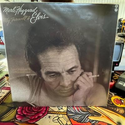 Sale Photo Thumbnail #163: Merle Haggard's My Farewell to Elvis, released in 1977. This album is also known by the title of its lead single, "From Graceland to the Promised Land". 
Here are some key details about the album:
Tribute Album: It's a tribute album dedicated to Elvis Pre