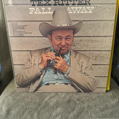 Sale Photo Thumbnail #187: "Fall Away" vinyl LP album by Tex Ritter, a renowned American country music singer and actor. 
Here are some key details about the album:
Artist: Tex Ritter.
Album Title: Fall Away.
Format: Vinyl LP (Long Play).
Label: Capitol Records.
Release Year: 1974.