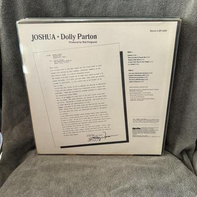 Sale Photo Thumbnail #194: "Joshua" vinyl LP album by Dolly Parton, released by RCA Victor in 1971. 
Key album details:
Release and Significance: "Joshua" is Dolly Parton's seventh solo studio album, released on April 12, 1971. The title track, "Joshua," was Parton's first song to 