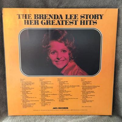 Sale Photo Thumbnail #204: "The Brenda Lee Story: Her Greatest Hits". This is a compilation album by American singer Brenda Lee, released by MCA Records in 1973. 
Here's some information about the album:
Content: This double-LP compilation features 22 of Brenda Lee's most popular s