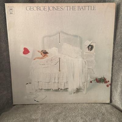 Sale Photo Thumbnail #207: "The Battle" by George Jones. 
Key facts about the album include:
Release and Label: Released in 1976 by Epic Records.
Genre: Country music.
Context: Recorded during George Jones' divorce from Tammy Wynette, the album's title is significant.
Notable Track