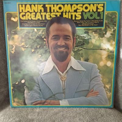 Sale Photo Thumbnail #239: "Hank Thompson's Greatest Hits Vol. 1". 
Here's information about the album and artist:
Artist: Henry William "Hank" Thompson, a well-known American country music entertainer whose career lasted seven decades, was known for his "honky tonk Western swing" 
