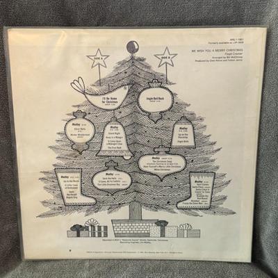 Sale Photo Thumbnail #258: "We Wish You a Merry Christmas" by Floyd Cramer, featuring "The Floyd Cramer Family" on the cover. 
Here is some information about the album:
Artist: Floyd Cramer was an American pianist known for his "slip-note" style and his contributions to the Nashvil