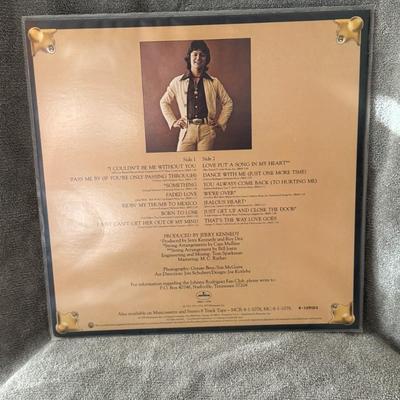 Sale Photo Thumbnail #380: "The Greatest Hits of Johnny Rodriguez". 
Here's information about this album:
Artist: Johnny Rodriguez, a country music singer.
Release Year: The album was originally released around 1975.
Record Label: Mercury Records.
Format: The image shows a 12-inch 