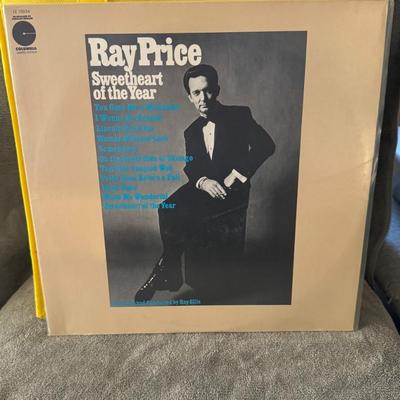 Sale Photo Thumbnail #385: "Sweetheart of the Year" by Ray Price. 
Information about the album:
Artist: Ray Price.
Album Title: Sweetheart of the Year.
Release Date: Released in June 1969.
Label: Columbia Records released the album, catalog number CS 9822 for the vinyl LP version.
